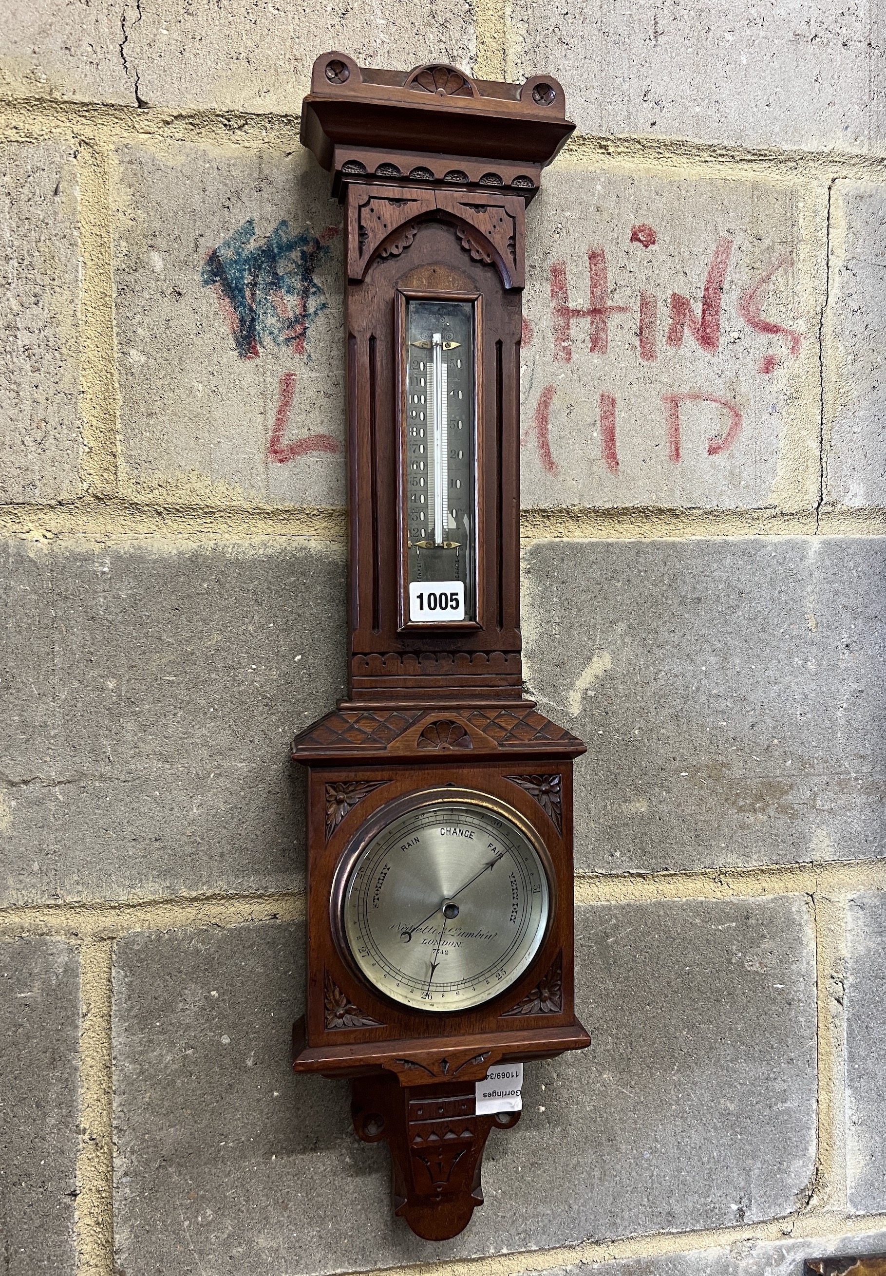 A Victorian walnut cased aesthetic movement style aneroid barometer and thermometer, Negretti & Zambra, London, numbered 7342, height 68cm